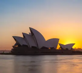 Couples taking a guided tour of Sydney Opera House during a honeymoon trip from Chennai