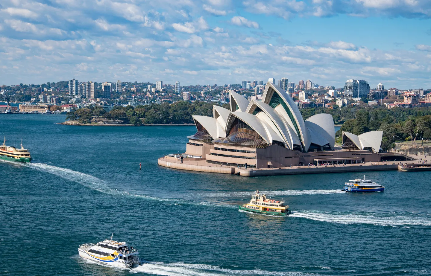 Couples visiting Sydney Opera House during a honeymoon trip from Chennai to Australia