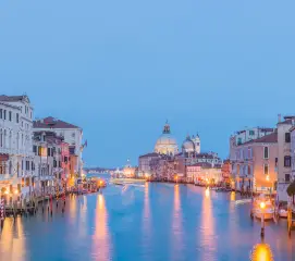 Romantic sunset canal cruise in Venice for honeymoon couples from Chennai