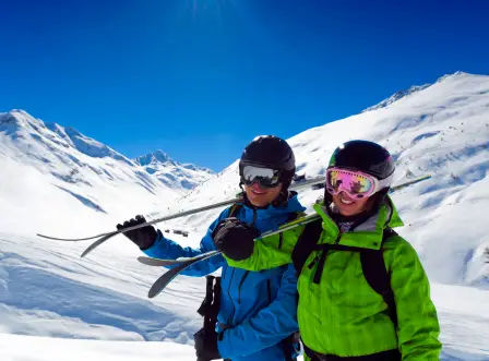 Couples skiing in the Swiss Alps during a Switzerland honeymoon package