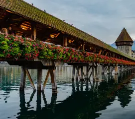 Couples visiting Lucerne Chapel Bridge during a Switzerland honeymoon trip